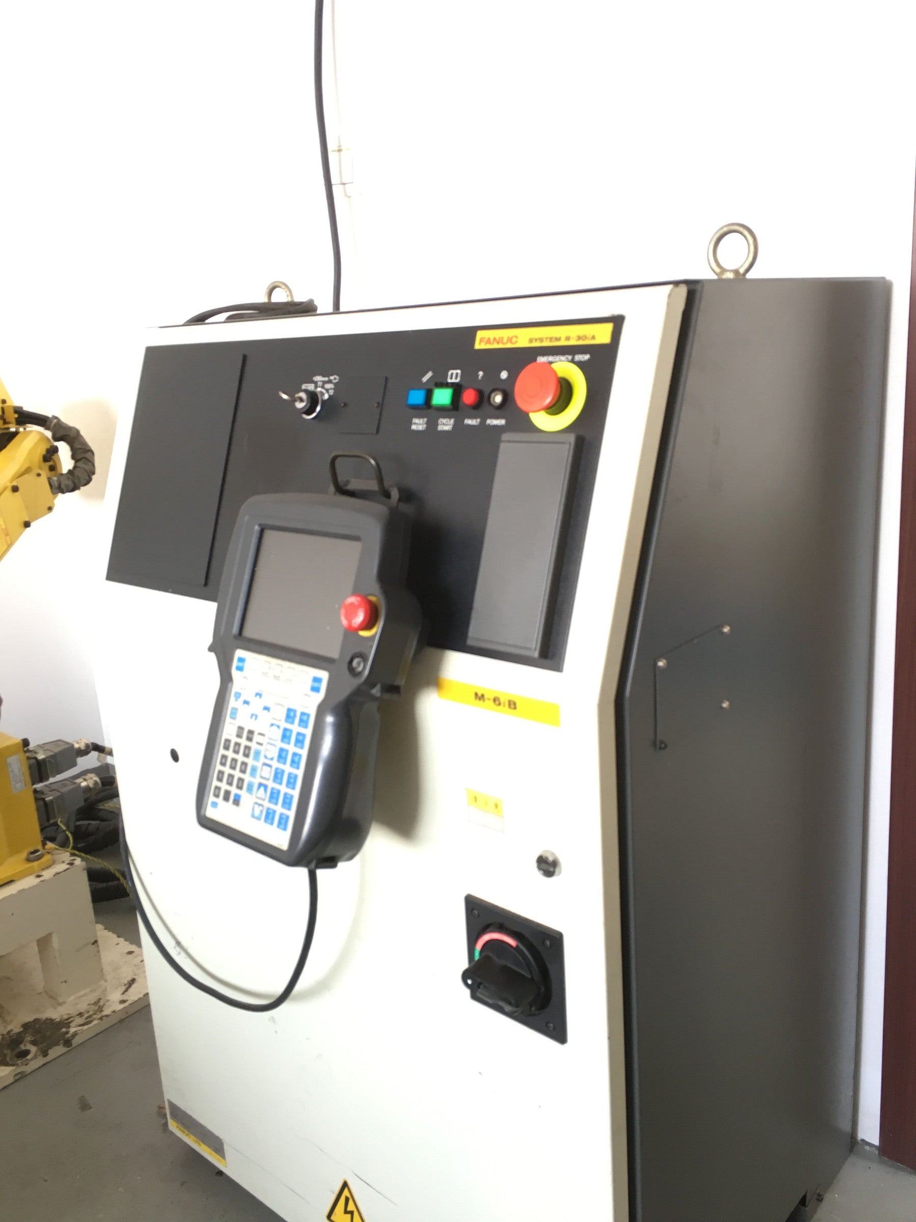 R-30iA Industrial robot testing bench used for controller and servo testing at REACO CNC.