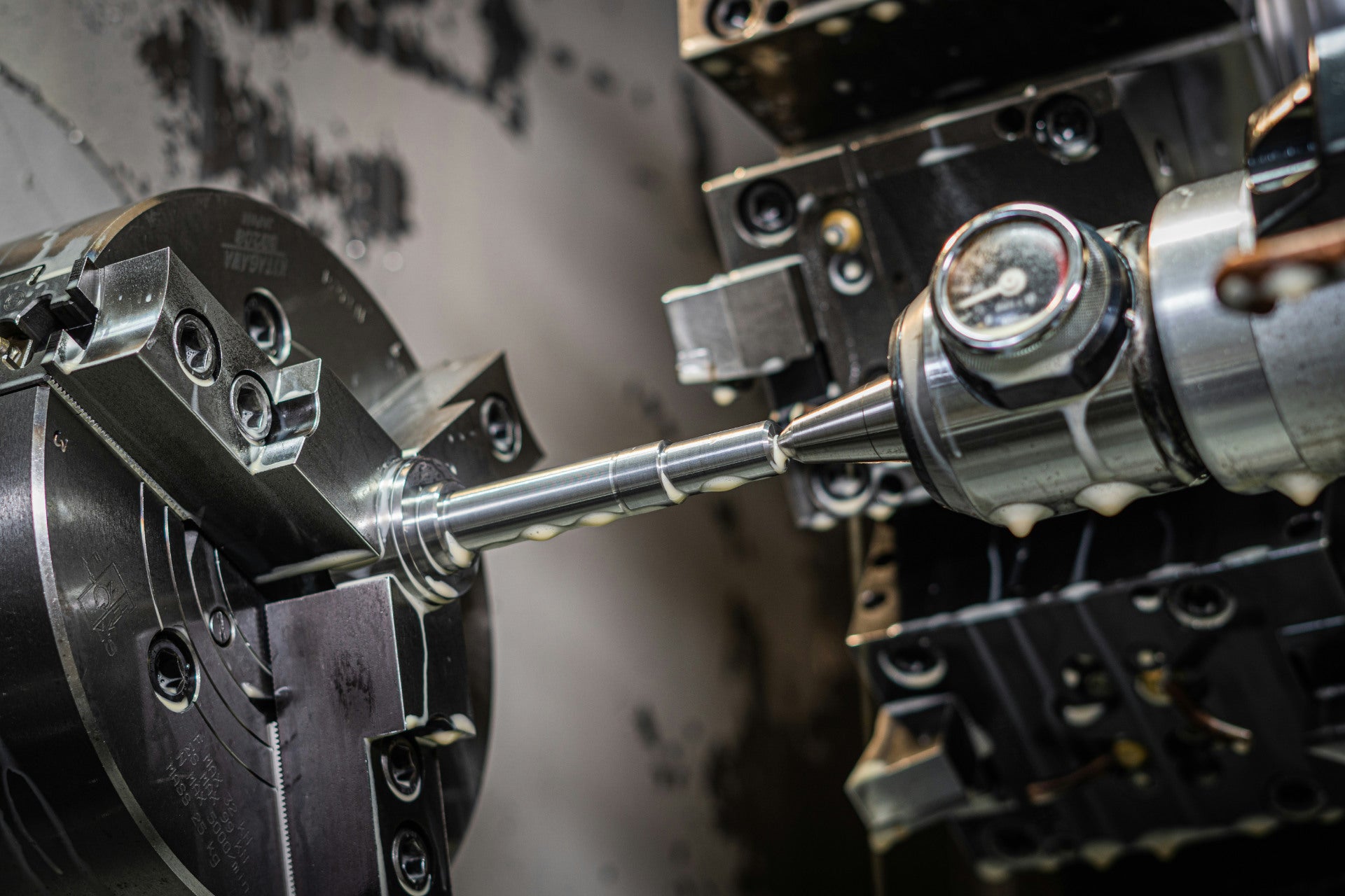 Industrial CNC lathe cutting metal components with automated precision.