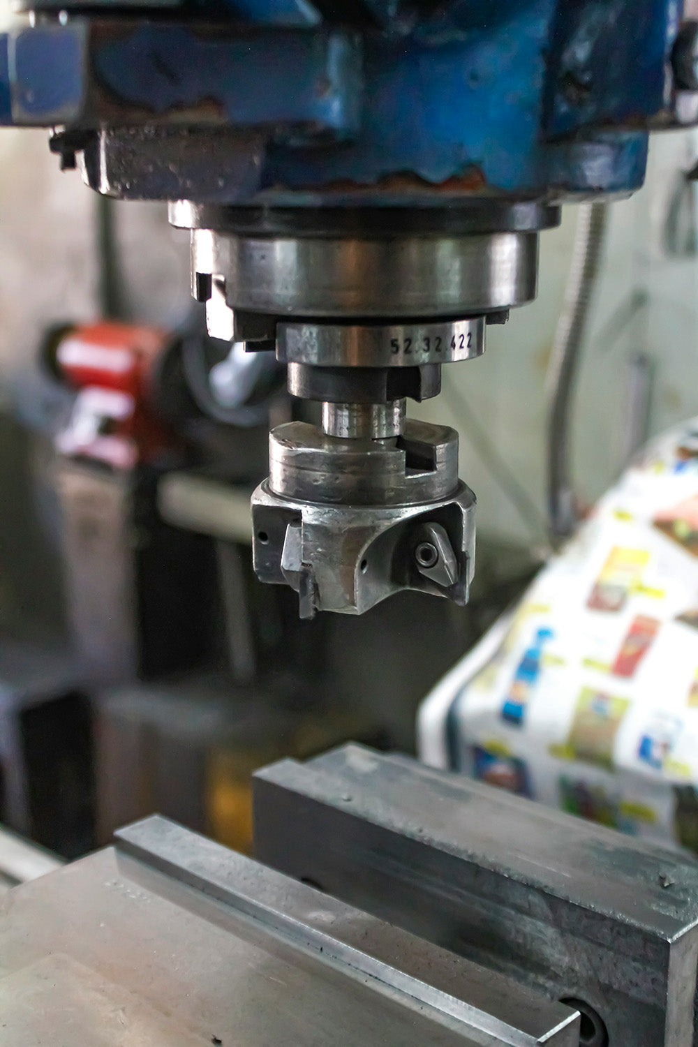 Close-up view of a milling spindle and cutter head on an industrial CNC machine.